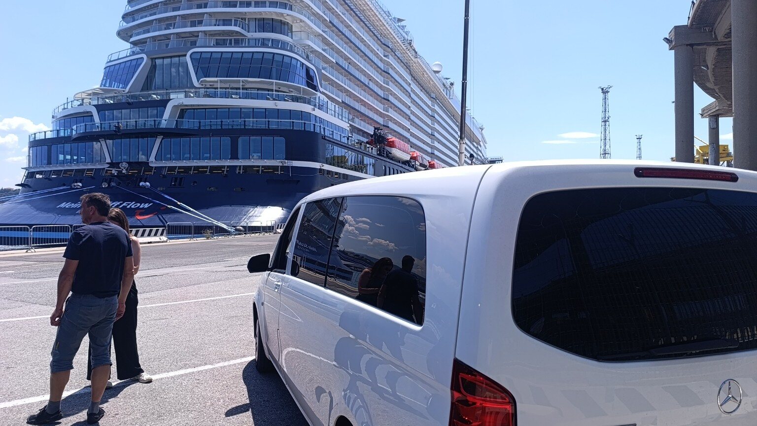 Mercedes Vito beside a cruise ship at the port